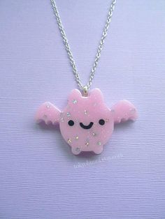 ☆Pastel Pink Kawaii Bat Necklace☆ ☆Bat is made of resin and glitter ☆Has pink glitter and tiny silver star sequins. ☆Chain measures 20 inches but can be made longer upon request.  ☆If you have any questions please message me! Kawaii Handmade Silver Necklaces, Kawaii Silver Handmade Necklaces, Handmade Silver Kawaii Necklaces, Handmade Silver Necklaces In Kawaii Style, Cute Pink Handmade Jewelry, Cute Pink Resin Necklace, Cute Handmade Pink Jewelry, Cute Pastel Jewelry For Gifts, Pink Playful Party Necklaces