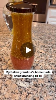 a jar filled with liquid sitting on top of a counter