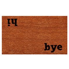 an orange door mat with the word bye on it and black letters in different font