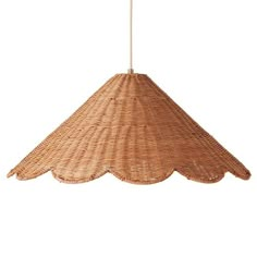 a light that is made out of wicker and has a long cord hanging from it