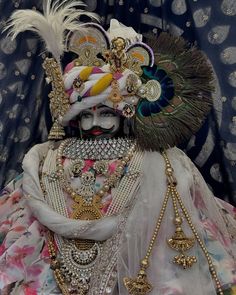 a woman dressed in elaborate clothing and jewelry