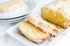 a white plate topped with slices of cake