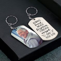 two keychains with an image of a man on one side and the words always never forgotten forever written on them