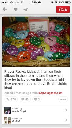 a basket filled with lots of colorful polka dot covered rocks next to a sign that says prayer rocks, kids put them on their pillows in the morning and then when they