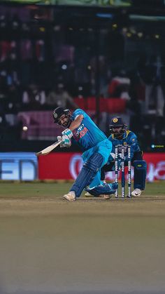 a cricket player hitting the ball with his bat