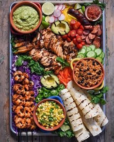 several plates of food on a wooden table