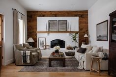 a living room filled with furniture and a fire place