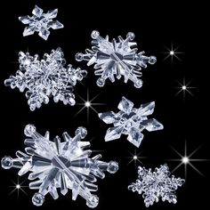 four snowflakes are shown on a black background