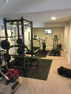 a home gym is shown with exercise equipment