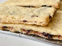 three cookies sitting on top of a cookie sheet