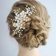 a woman wearing a bridal hair comb with pearls