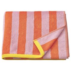 an orange and pink towel folded on top of each other