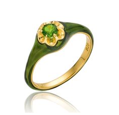 This petite edition of our bestselling Parlor Ring features a stunning emerald green Chrome Diopside at its center. Chrome Diopside is a relatively modern discovery, discovered in the most remote regions of frigid Siberia. It is noted for its intense and vibrant green hue-one that surpasses most natural emeralds. It rests in an antique style Belcher setting, which references the Victorian fretwork and Gothic architecture that was popular at the time. It's surrounded by a matching enamel exterior. The Emerald Petite Parlor Ring is the perfect introduction to the color green, often regarded as one of the least popular colors. The slim profile allows the ring to be stacked with many other designs, or can work great as a pinky ring.  0.25 carat round brilliant cut natural, untreated green chro Elegant Green Enamel Ring With Polished Finish, Elegant Green Enamel Ring, Classic Green Enamel Jewelry, Elegant Green Enamel Gemstone Ring, Formal Green Enamel Ring With Polished Finish, Green Hallmarked Enamel Ring For Anniversary, Hallmarked Green Enamel Ring For Anniversary, Green Enamel Ring For Formal Occasions, Green Enamel Ring With Polished Finish For Anniversary