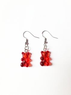 "Red Gummy Bear Earrings * These cute and fun earrings are perfect for anyone who loves sweet treats and unique accessories. ♥ Handmade with love by Lucy, a twelve year old, homeschooler ♥ Gummy Bear Details Length: 15/16\" Width: 7/16\" Nickel Free" Fun Red Resin Earrings, Fun Style Red Resin Earrings, Trendy Red Earrings For Birthday, Red Resin Novelty Earrings, Fun Red Resin Jewelry, Novelty Red Resin Jewelry, Red Resin Novelty Jewelry, Playful Nickel-free Red Earrings, Playful Red Dangle Jewelry