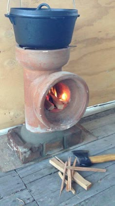 an old brick oven is being used as a fire place for wood burning in the fireplace