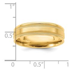 a yellow gold wedding band that has been engraved on the side and is shown with measurements for