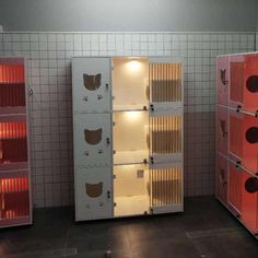 several red and white lockers are lined up against the wall in a room with tile flooring