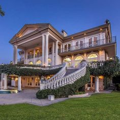 a large house with stairs leading up to it