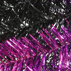 purple tinsel is hanging from the ceiling