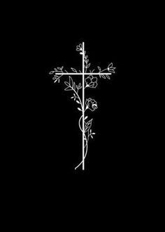 a cross with flowers on it in the middle of a black background and white lettering