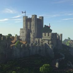 an old castle sits on top of a hill