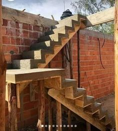 the stairs are made out of wood and brick