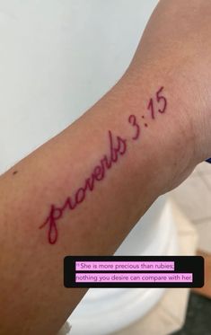 a person with a tattoo on their arm that reads provely 3 15 and has the word jesus written in red ink