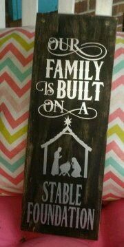 a sign that says our family is built on a stable foundation sitting on a chair