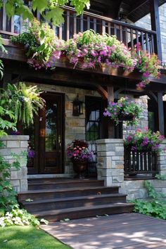 a house with lots of flowers on the front porch