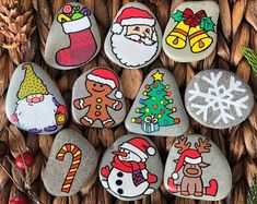 some rocks decorated with christmas decorations and santa clause