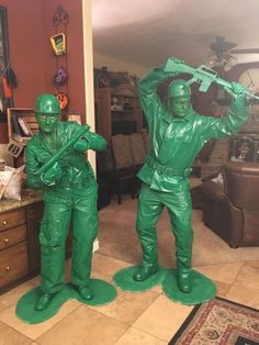 two statues of men in green plastic uniforms