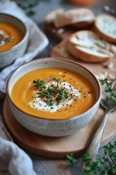 Creamy pumpkin soup garnished with herbs and black pepper, with a side of sliced bread. Sweet Potato Soup Healthy, Potato Soup Healthy, Thai Coconut Curry Soup, Rich Beef Stew, Sweet Potato Soup Recipes, Coconut Curry Soup, Soup Healthy, Yummy Sweet Potatoes, Potato Soup Recipe