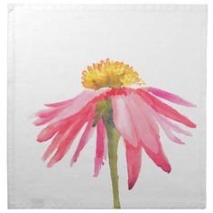 a pink and yellow flower on a white napkin