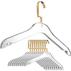 a metal hanger with gold clips on it