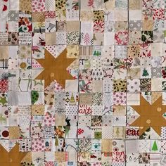 a patchwork quilt with many different patterns and designs on the fabric, including stars