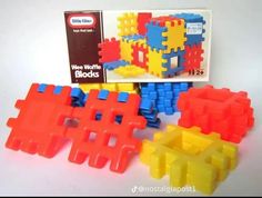 three different colored blocks are shown in front of a box and the first one is made out of plastic