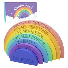 rainbow stackers with inspirational sayings on them in front of a greeting card box