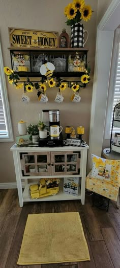 the sunflowers are hanging on the wall above the buffet table in the kitchen