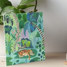 a painting of a tiger in the jungle art board print