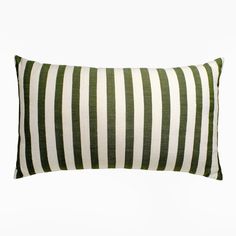 a green and white striped pillow on a white background