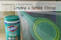 a kitchen counter with plastic containers and utensils in it that are labeled cooking in a hotel room creating a portable kitchen