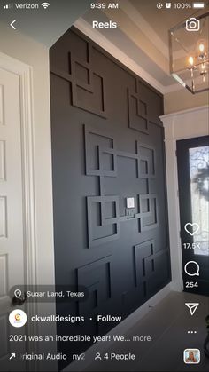 an image of a door that has been painted black and is being viewed on the phone