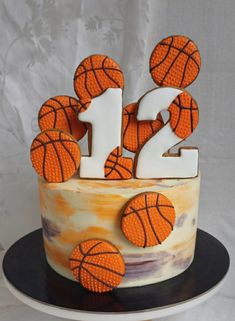 a birthday cake decorated with basketballs and the number twenty two