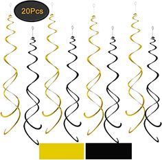 black and yellow swirls hanging from strings with the number 20 on it's side