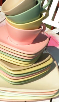 a stack of colorful dishes sitting on top of each other