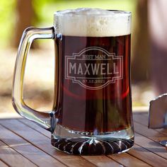 a beer mug sitting on top of a wooden table