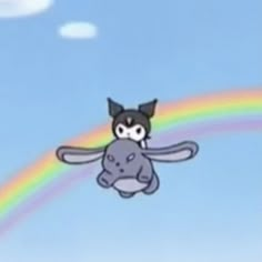 a cartoon cat flying over a rainbow in the sky