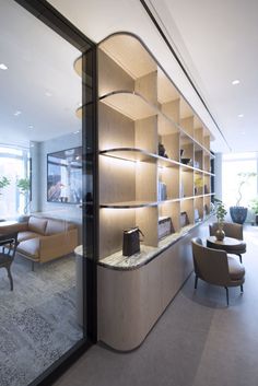 Sapientia Investment Office Photo Featuring CarpetGlass Wallsmounted-cove-lightingPlywoodRecessed DownlightSofasModular LoungeWood. Cool Office Space, Office Shelf, Joinery Details, Office Space Design, Modular Lounges, Contemporary Office, Cool Office