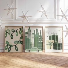 three framed art pieces with green and white designs on them, hanging from the ceiling