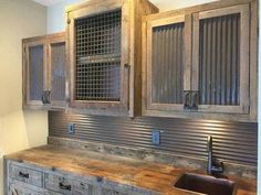 a kitchen with wooden cabinets and a sink